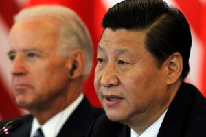 Chinese Vice President Xi Jinping (R) speaks next to U.S. Vice President Joe Biden during talks at a hotel in Beijing August 19, 2011. REUTERS/Ng Han Guan/Pool (CHINA - Tags: POLITICS)